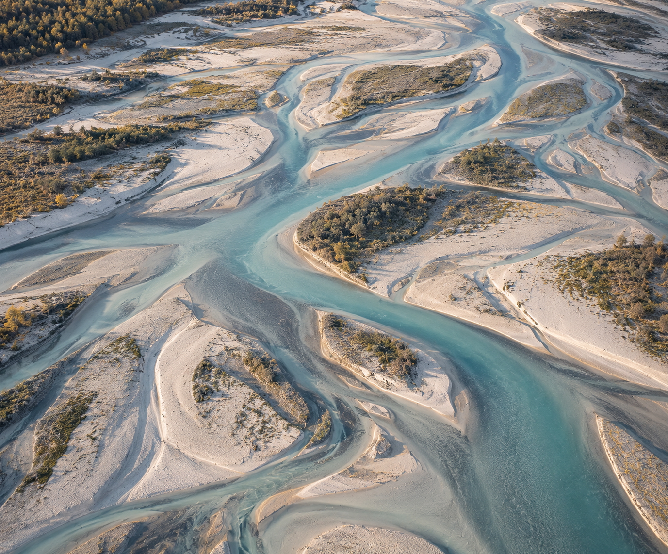 An aerial river system branching and reconnecting across one landscape