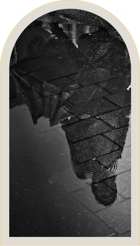 A figure emerging through rippling water